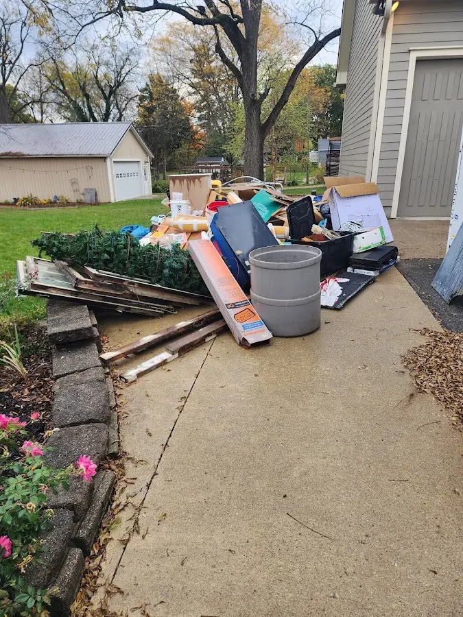 Dumpster being loaded with debris for Commercial Dumpster Rental in Economy